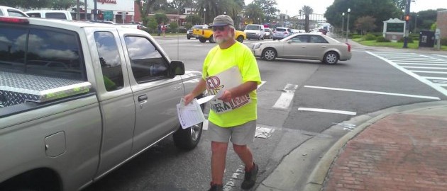 Man arrested for peacefully protesting red light cameras