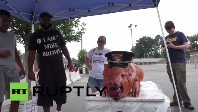 Ferguson Protestors Bring Roasted Pig To Police Station, Shoot It Out With Cops, State Of Emergency Declared