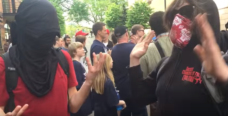 “Tranny” Protestor Spits In Face Of Trump Supporter