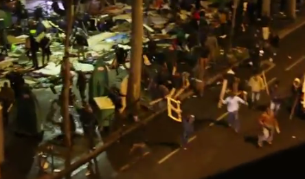 Hundreds of Migrants with Metal Poles Battle Vigilantes in Ferocious Melee