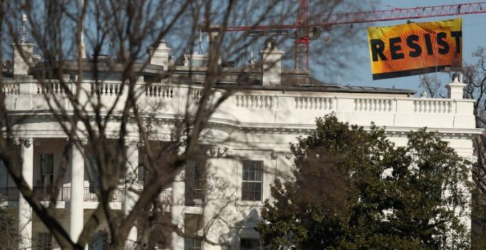 Greenpeace Activists Climb Crane, Hang ‘Resist’ Sign Near White House